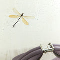 Luna Bag: Full-grain leather accessory with silver hardware clasp, detailed stitching, and dragonfly motif.