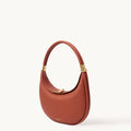 Oolong Luna Bag with gold hardware and adjustable strap, made of pebbled full-grain leather.