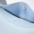 Pale blue leather Luna Bag interior with magnetic snap closure