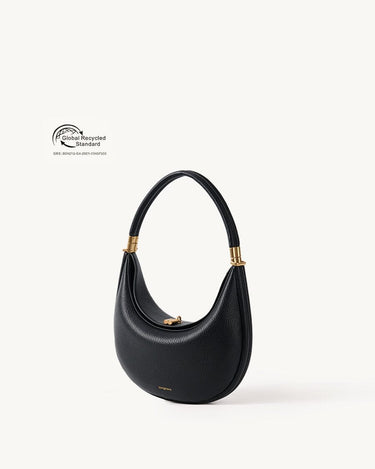 Black vegan leather Luna Bag with gold hardware and a crescent moon shape, featuring Global Recycled Standard certification.