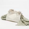 Cloud Medium Gather Bag Set with draped green fabric. Soft leather tote with drawstring closure and adjustable strap.