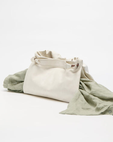 Cloud Medium Gather Bag Set with draped green fabric. Soft leather tote with drawstring closure and adjustable strap.