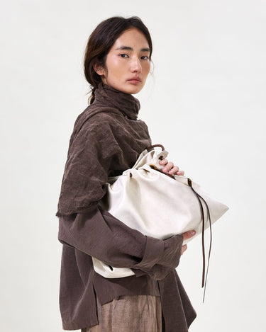 Medium Gather Bag Set in Cloud white Nappa leather with adjustable straps and a unique gathered design.
