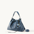 Medium Gather Bag Set in navy blue Nappa leather with gold hardware and adjustable strap.