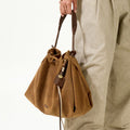 Ochre Suede Medium Gather Bag Set with braided straps and leather charm.