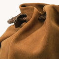 Medium Gather Bag Set in Ochre Suede with braided leather drawstring and handle.