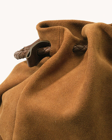 Medium Gather Bag Set in Ochre Suede with braided leather drawstring and handle.