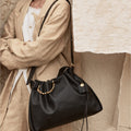 Medium black leather Gather Bag Set with a drawcord closure and beaded handle