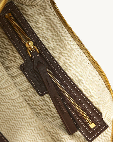 Large Luna Hobo Bag interior: brass zipper, dark brown leather pull tab with Songmont logo, beige herringbone lining.