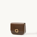 Medium Reset Tofu Bag in Caramel calfskin leather with gold buckle closure.