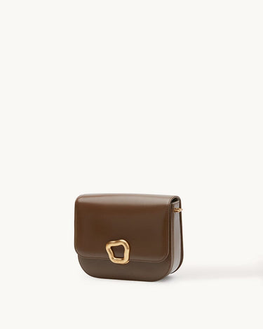 Medium Reset Tofu Bag in Caramel calfskin leather with gold buckle closure.