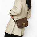 Medium Reset Tofu Bag in Caramel: A stylish leather crossbody bag with gold buckle, crafted from fine calf leather for women.
