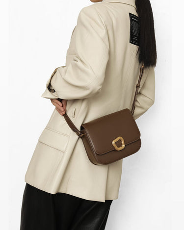 Medium Reset Tofu Bag in Caramel: A stylish leather crossbody bag with gold buckle, crafted from fine calf leather for women.
