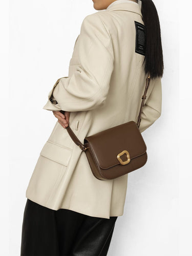 Medium Reset Tofu Bag in Caramel: A stylish leather crossbody bag with gold buckle, crafted from fine calf leather for women.