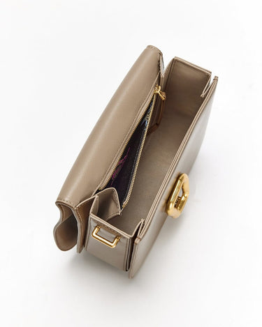 Medium Reset Tofu Bag in Caramel calf leather with gold hardware and interior compartments.
