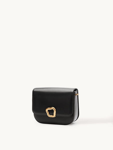 Medium Reset Tofu Bag in Onyx black calf leather with gold Wonton ring closure