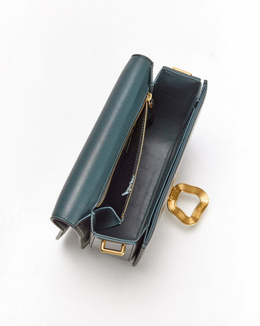 Opened Onyx Medium Reset Tofu Bag with teal interior, gold Wonton ring, and compartments.