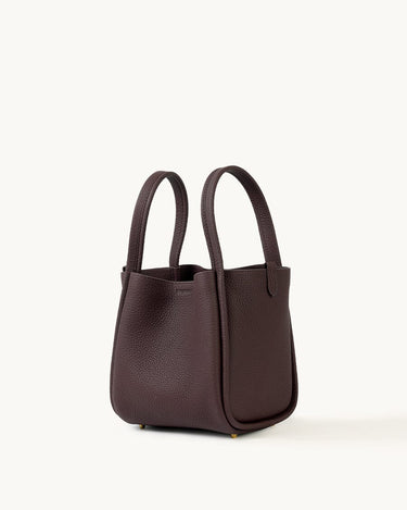 Medium burgundy Song Bag crafted from full-grain leather with a structured base and dual top handles.