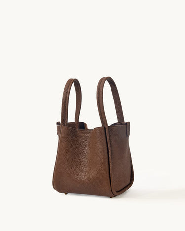 Medium Song Bag in chocolate brown textured full-grain leather with two top handles.