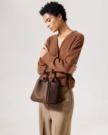 Medium Song Bag in Chocolate textured leather with gold hardware. Stylish, functional leather bag.