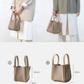 Medium Song Bag in taupe pebbled full-grain leather, shown with dimensions compared to the Small Song Bag.