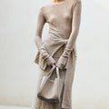 Medium Song Bag in Haze: Textured grey nubuck leather, minimalist design, gold hardware.