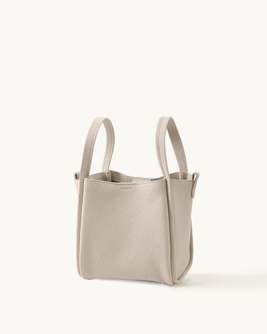 Medium Song Bag in Ivory pebble-grain leather with short handles.