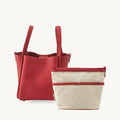 Medium Song Bag in Lucky Red leather with a detachable canvas inner pouch.