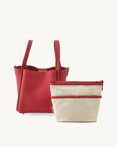 Medium Song Bag in Lucky Red leather with a detachable canvas inner pouch.