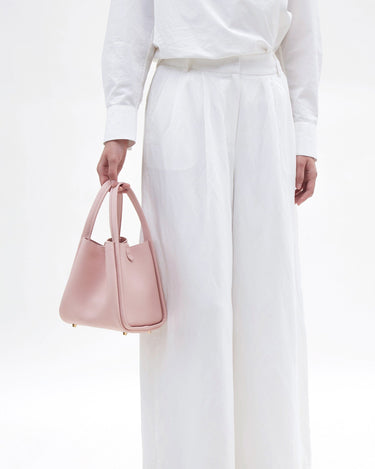 Medium Song Bag in Pink pebbled leather, a stylish and structured carryall.
