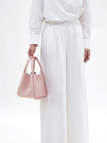 Medium Song Bag in Pink pebbled leather, a stylish and structured carryall.