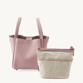 Pink medium Song Bag with tan fabric inner pouch, leather purse with textured finish and zipper bag.