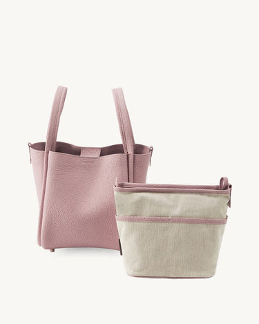 Pink medium Song Bag with tan fabric inner pouch, leather purse with textured finish and zipper bag.