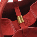 Red Medium Song Bag interior with gold hardware detail