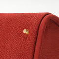 Medium Song Bag in Poppy red nubuck leather with textured finish and golden hardware.