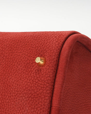 Medium Song Bag in Poppy red nubuck leather with textured finish and golden hardware.