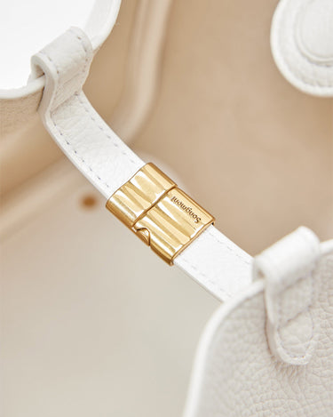 Medium Song Bag in Eco Cloud vegan leather with gold hardware closure featuring embossed Songmont logo.