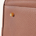 Medium Yore Duffle Bag in Golden Brown full-grain leather with detailed stitching and branded hardware.