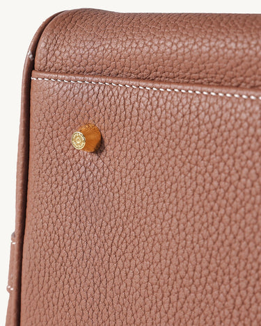 Medium Yore Duffle Bag in Golden Brown full-grain leather with detailed stitching and branded hardware.
