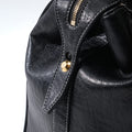Medium Yore Duffle Bag in Onyx: Textured vegan leather with gold zipper and white stitching.