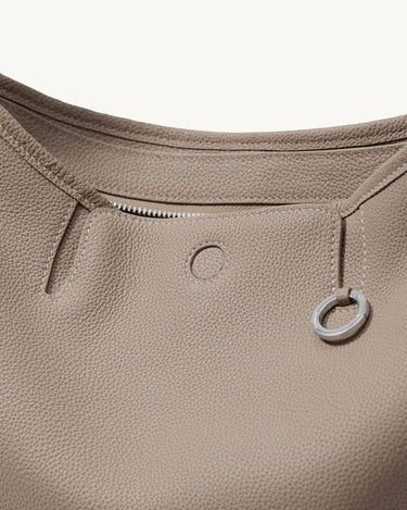 Medium Yore Hobo Bag in Cobble Grain textured leather with silver hardware and zipper.