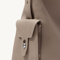 Medium Yore Hobo Bag in Cobble Grain tumbled full-grain leather with a front flap pocket and silver hardware.