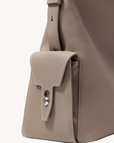 Medium Yore Hobo Bag in Cobble Grain tumbled full-grain leather with a front flap pocket and silver hardware.