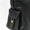 Medium Yore Hobo Bag in Onyx, black vegetable-tanned leather with white stitching and gold clasp.