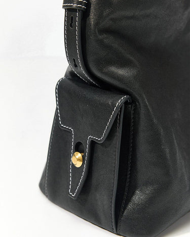 Medium Yore Hobo Bag in Onyx, black vegetable-tanned leather with white stitching and gold clasp.