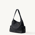 Medium Yore Hobo Bag in Onyx Grain full-grain leather with white stitching and gold hardware.