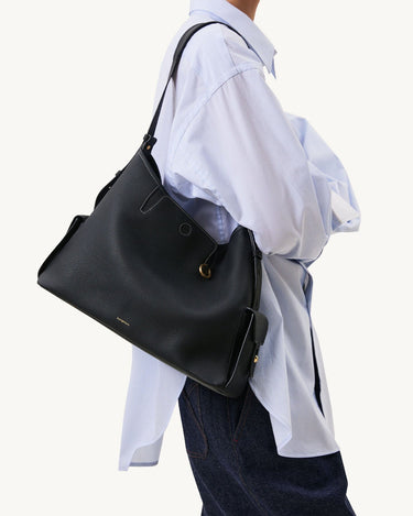 Medium Yore Hobo Bag in Onyx Grain textured full-grain leather with white stitching and gold hardware
