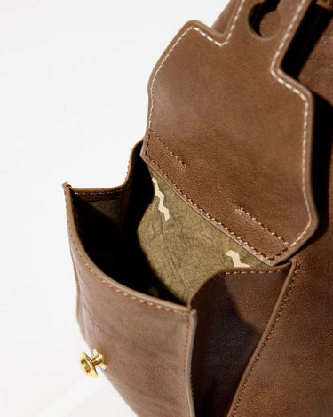 Medium Yore Hobo Bag in Sandal color, showing interior green lining and exterior pocket detail.