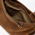 Medium Yore Hobo Bag in Sandal Suede, showing interior with zippered and slip pockets.
