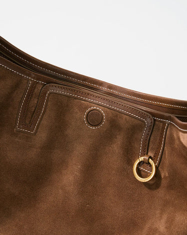 Medium Yore Hobo Bag in Sandal Suede, crafted from cow suede leather with white stitching and gold hardware.